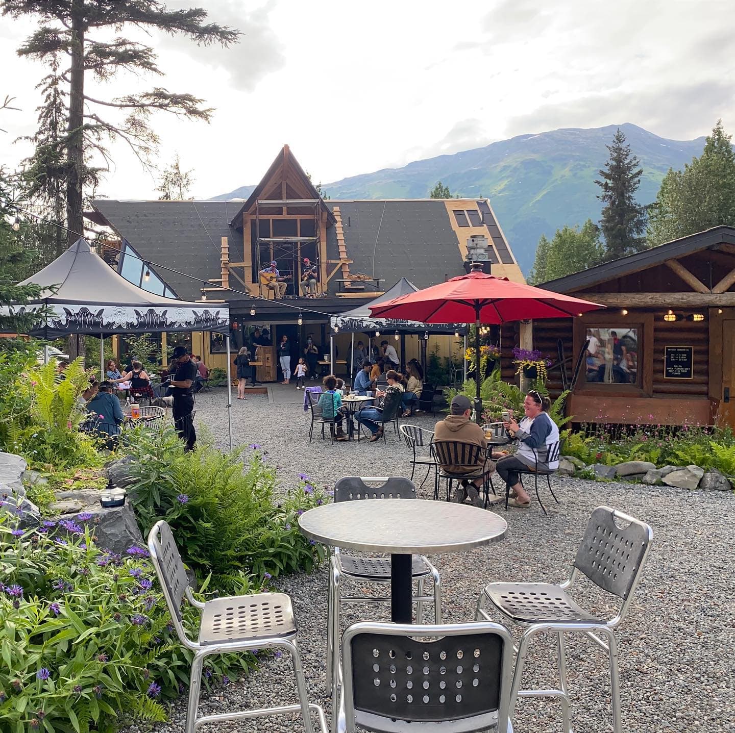 Live music on the patio at Jack Sprat, mountains behind the crowd