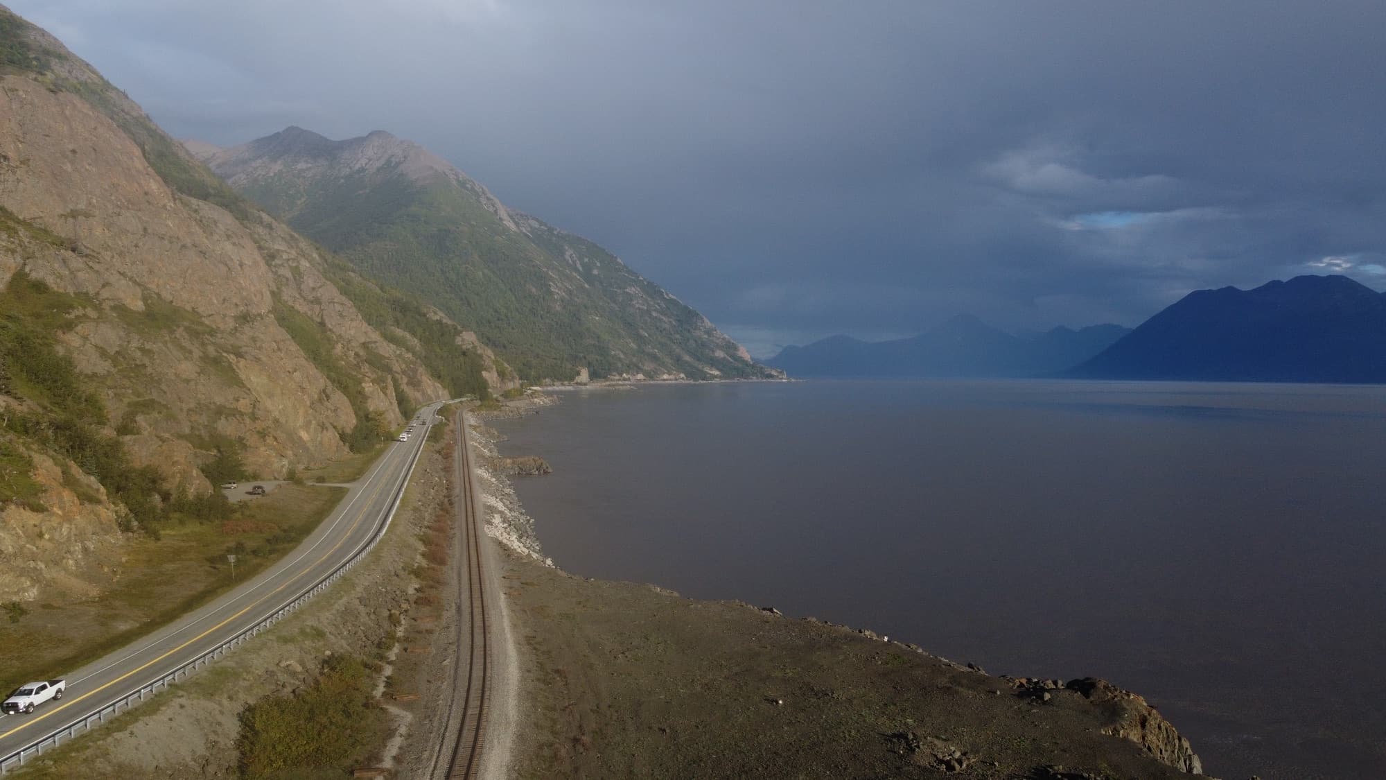 The Seward Highway and the Alaska Railroad hugging the mountainous shore of Turnagain Arm